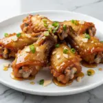 crispy air fryer chicken wings with honey garlic glaze - featured image