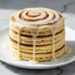 fluffy cinnamon roll pancakes with cream cheese glaze - featured image